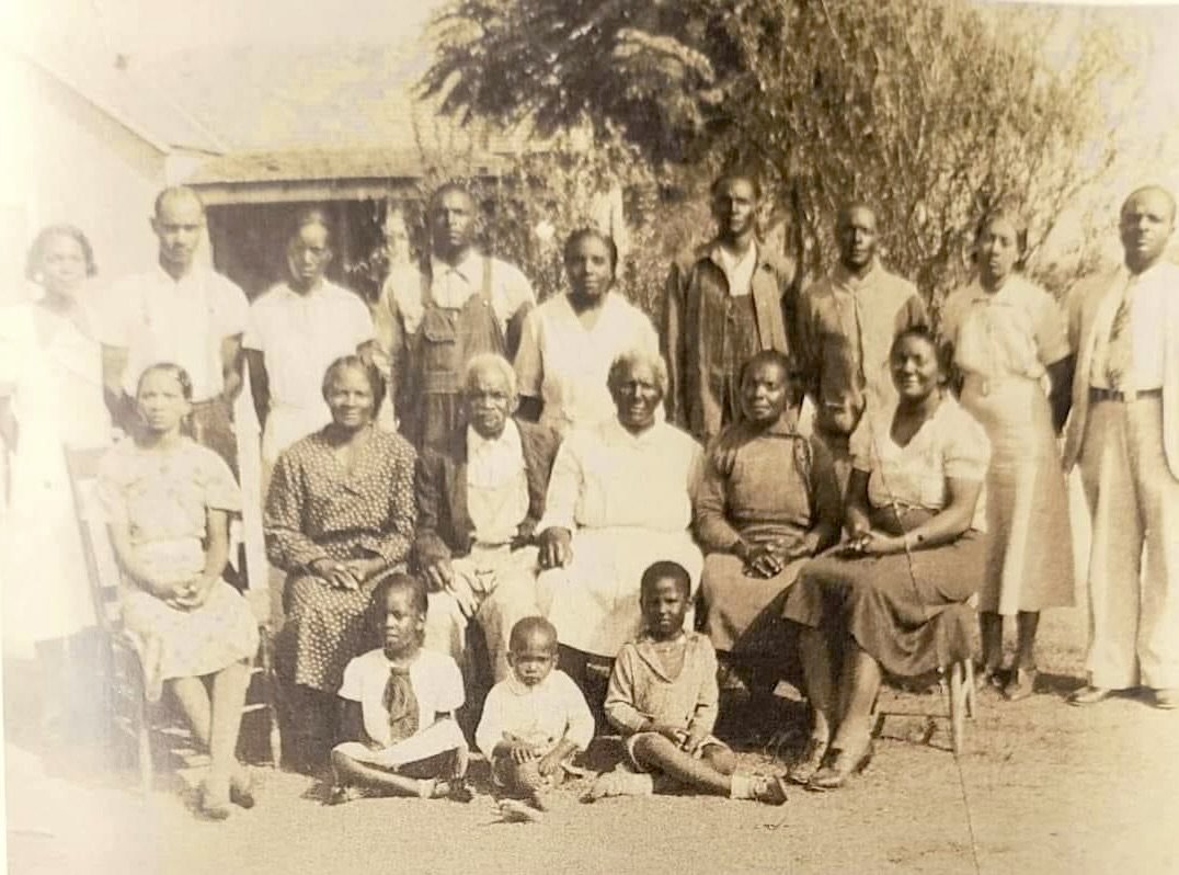 A sepia older photo of a Black family