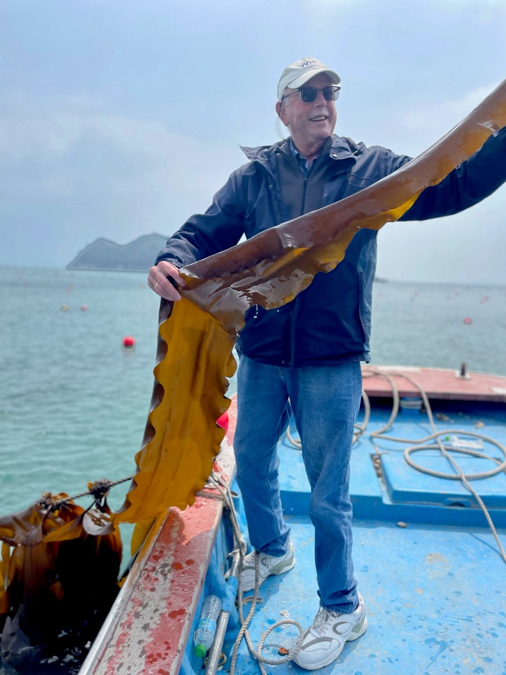 Charles Yarish holding Saccharina japonica seaweed offshore of Wando, South Korea, in 2023. (Photo courtesy of Charles Yarish)