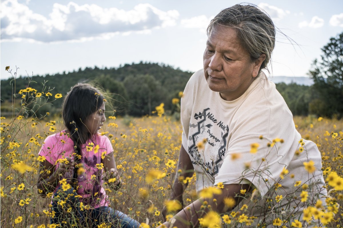 Traditional forager Twila Cassadore of the San Carlos Apache Nation gathers wild amaranth seeds with her niece, as seen in the documentary Gather. (Photo credit: Renan Ozturk)