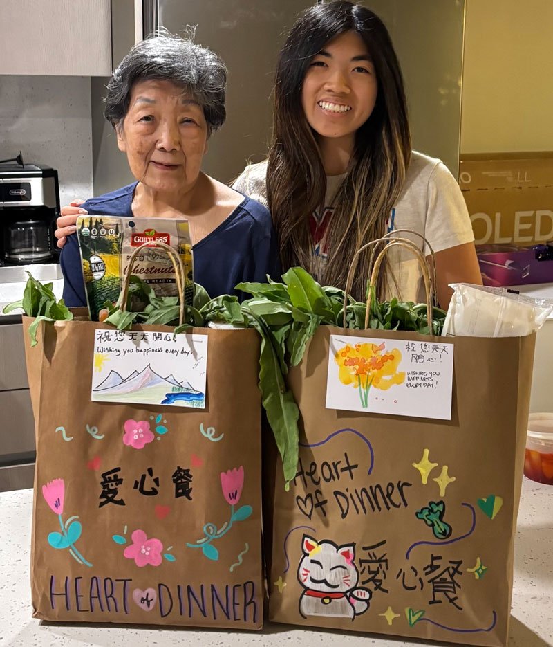 Allyson Eng with her grandmother Joan after she received a Heart of Dinner delivery in LA this month. Joan and her husband Joseph lost their home in the Altadena wildfires. (Photo courtesy of Heart of Dinner)