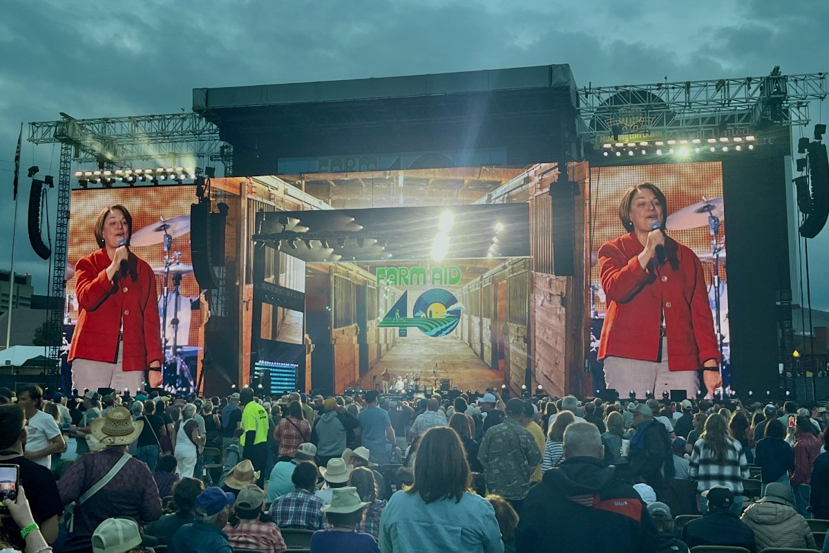 Senator Amy Klobuchar (D-Minnesota) speaks on stage at Farm Aid 40 in Minnesota. (Photo credit: Lisa Held)