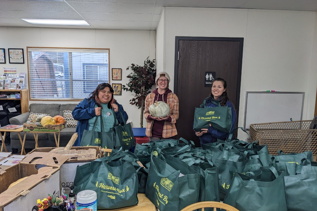 In Humboldt County, volunteers prepare Harvest Box distribution to the Fortuna Resource Center over the holidays in 2023. The Harvest Boxes were part of the North Coast Growers' Association food hub, created in part as a result of the Partnership. (Photo credit: Megan Kenney)