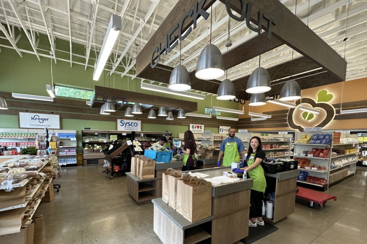 Inside The Store, a free grocery store, where two people are standing at the check out line